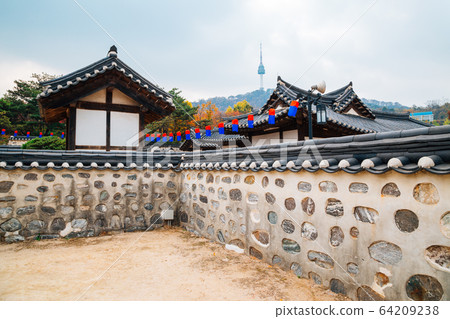 Korean traditional house and Namsan Seoul tower at autumn in Korea 64209238