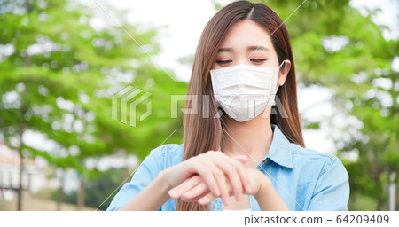 Asian woman with facial mask Asian woman with facial mask 64209409