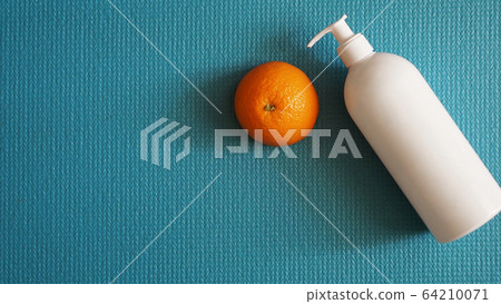 Lotion and orange fruit - anti-cellulite concept 64210071