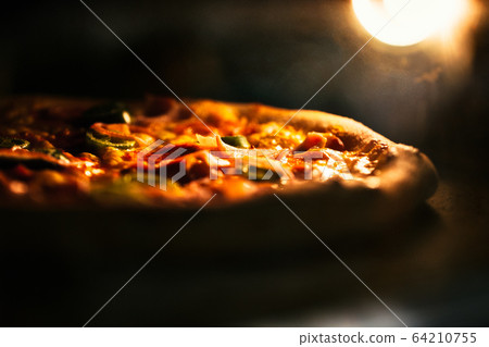 Pizza baked in an electric oven close-up Pizza baked in an electric oven close-up 64210755