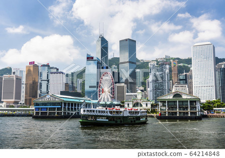 Star Ferry on the way to Central Pier harbor with hong kong's skyscrapers in the background Star Ferry on the way to Central Pier harbor with hong kong's skyscrapers in the background 64214848