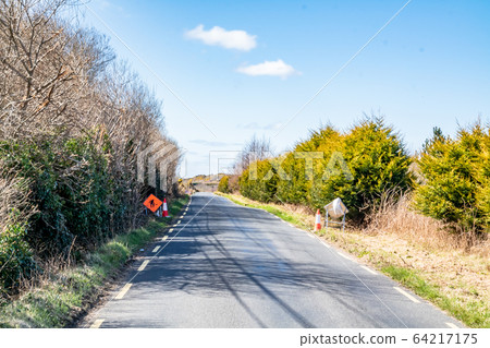 Empty country road in County Donegal during the Coronavirus pandemic - Ireland 64217175