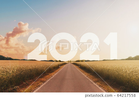 empty straight road heading to happy new year 2021 empty straight road heading to happy new year 2021 64217558