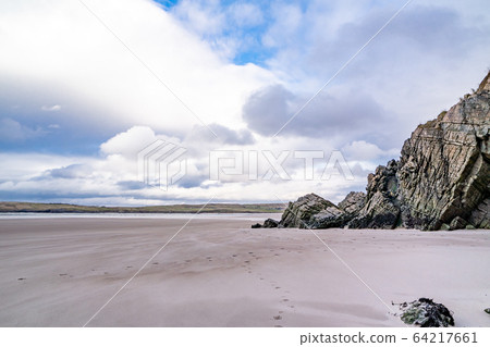 The beach and caves at Maghera Beach near Ardara, County Donegal - Ireland. The beach and caves at Maghera Beach near Ardara, County Donegal - Ireland. 64217661