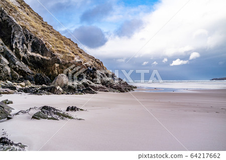 The beach and caves at Maghera Beach near Ardara, County Donegal - Ireland. The beach and caves at Maghera Beach near Ardara, County Donegal - Ireland. 64217662
