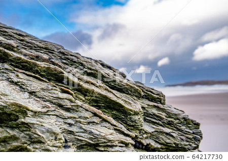 The beach and caves at Maghera Beach near Ardara, County Donegal - Ireland. 64217730