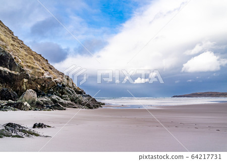 The beach and caves at Maghera Beach near Ardara, County Donegal - Ireland. The beach and caves at Maghera Beach near Ardara, County Donegal - Ireland. 64217731