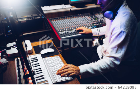 producer, composer arranging a song in home recording studio. music production technology concept 64219095