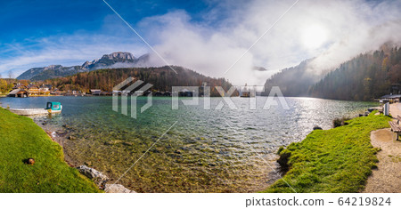 Mountain alpine autumn misty morning lake Konigssee, Schonau am Konigssee, Berchtesgaden national park, Bavaria, Germany. 64219824