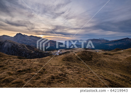 Evening twilight autumn alpine Dolomites mountain scene, Trento, Italy. Lake or Laghetto Baita Segantini view. Evening twilight autumn alpine Dolomites mountain scene, Trento, Italy. Lake or Laghetto Baita Segantini view. 64219943