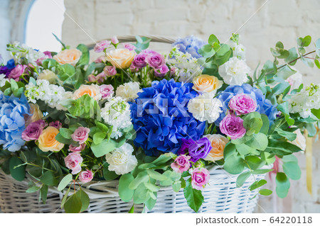 Large floral basket with flowers at flower shop Large floral basket with flowers at flower shop 64220118