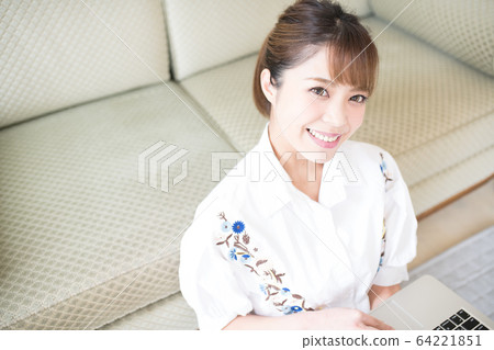 Woman watching video 64221851