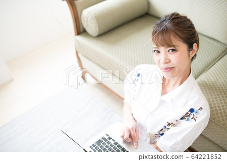 Woman watching video 64221852