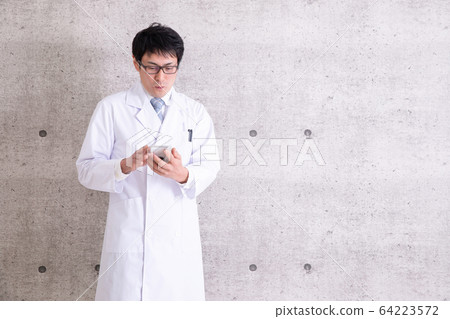 A man in a white coat A man in a white coat 64223572