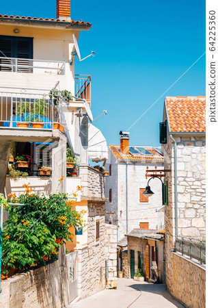 Primosten old town street at summer in Croatia 64225360