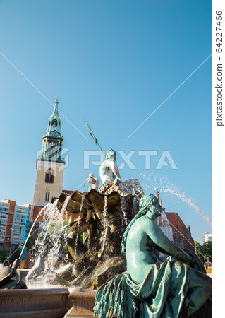 Neptune Fountain with St. Mary's Church Marienkirche in Berlin, Germany 64227466