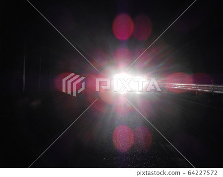 Oncoming car headlight 64227572