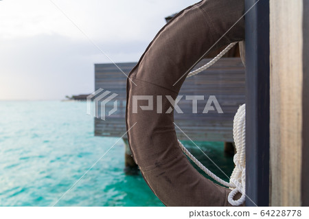 Life ring in luxury resport background. 64228778