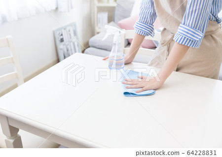 Woman hand table disinfection Woman hand table disinfection 64228831