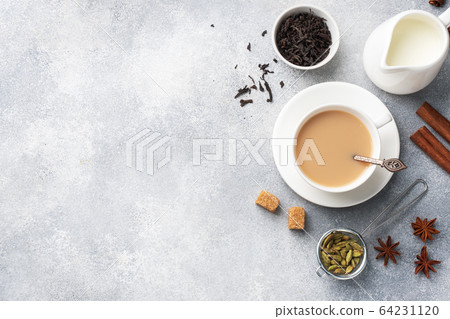 Indian drink masala tea with milk and spices. Indian drink masala tea with milk and spices. 64231120