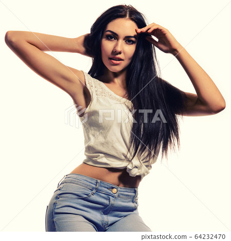 Young positive brunette girl with long hair 64232470