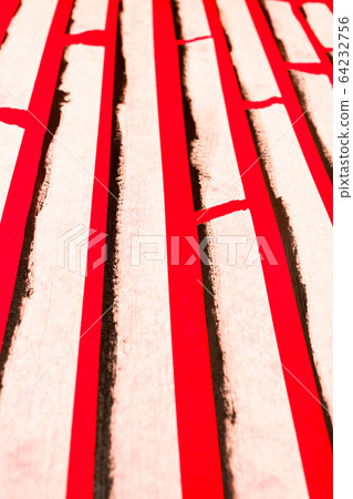 close up of an adhesive tape on red background 64232756