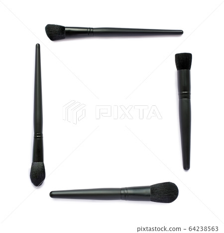 Frame of black makeup brushes isolated on white background 64238563