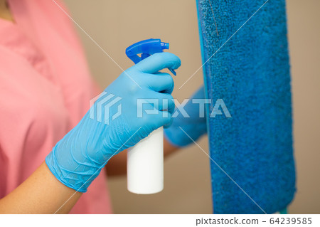 Women hand in a blue rubber glove in the picture, removes and washes bathroom sink by spray and sponge, hygiene concept Women hand in a blue rubber glove in the picture, removes and washes bathroom sink by spray and sponge, hygiene concept 64239585