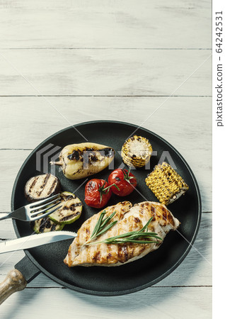 Fried chicken fillet and boiled vegetables 64242531