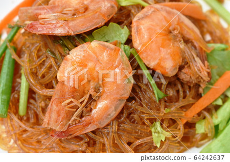 baked glass noodles with slice carrot and celery topping shrimp on plate 64242637