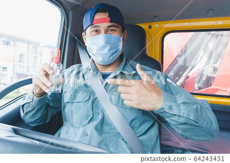 Truck driver wearing a mask Truck driver wearing a mask 64243431