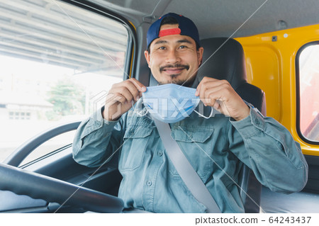Truck driver wearing a mask Truck driver wearing a mask 64243437