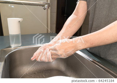 Hygiene concept. Washing hands with soap under the 64245184