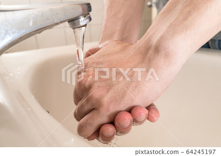 Hygiene concept. Washing hands with soap under the Hygiene concept. Washing hands with soap under the 64245197