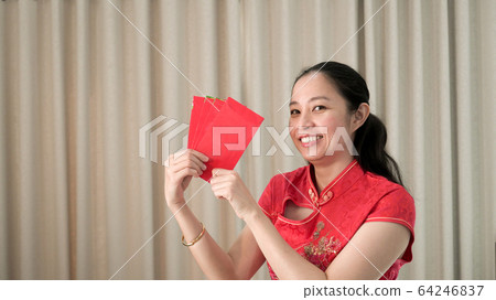 Asian woman happy face chinese new year festival red traditional costume Asian woman happy face chinese new year festival red traditional costume 64246837