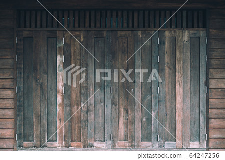 Old brown vintage window on wooden wall of Residential, home acient design Old brown vintage window on wooden wall of Residential, home acient design 64247256