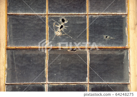 Old destroyed abandoned yellow house with the 64248275