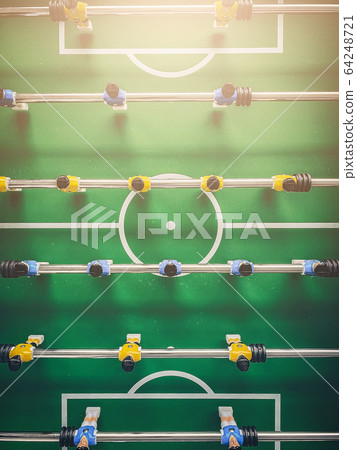 Table soccer game. Close-up. Top view. Toning. 64248721