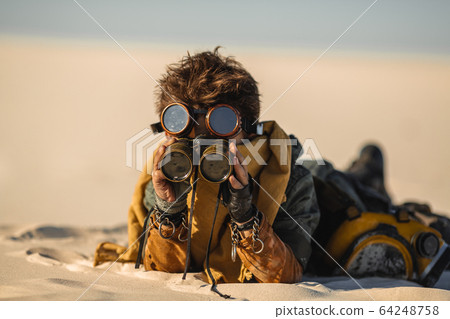 Post-apocalyptic Warrior Boy Outdoors in a Wasteland 64248758
