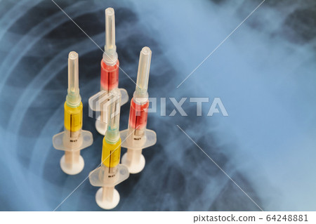 Syringes with various medicines on the background Syringes with various medicines on the background 64248881