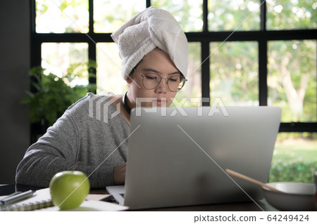 Woman working from home 64249424