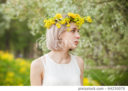Nice woman in spring park outdoor Nice woman in spring park outdoor 64250078