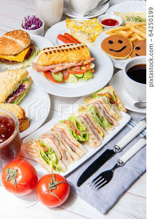 Breakfast, sandwiches, burgers, pancakes, eggs, vegetables, coffee, dining table 64250199