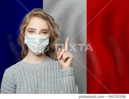 Woman in medical mask pointing up  64250296