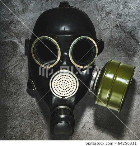 Gas mask on a black stone background, protection Gas mask on a black stone background, protection 64250331