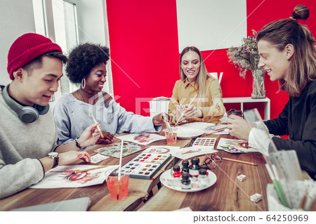 Happy mixed raced people visiting art workshop Happy mixed raced people visiting art workshop 64250969