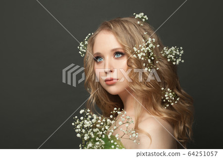 Nice woman with long healthy curly hair. Gorgeous 64251057