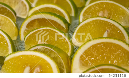 The close up of fresh citrus sinensis fruit (sweet orange) on glass plate. The close up of fresh citrus sinensis fruit (sweet orange) on glass plate. 64251116