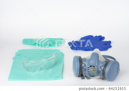 Twin filter half face respirator mask, plastic protective eyglasses, protective gown, cap, pair of gloves,  personal protective equipment to protect against the virus covid-19. 64251915