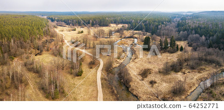 Rural panorama of spring woodland and river. Rural panorama of spring woodland and river. 64252771
